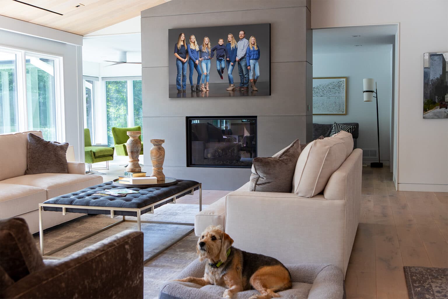 Beautiful Family Portrait above a modern fireplace in a designer living room